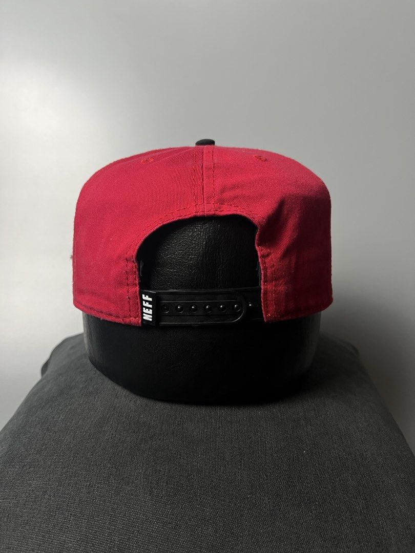 Neff Custom Goods Snapback Cap Red Black (Category: Caps & Hats) located in Dagupan City. Submitted by loves2thrifth (Listing ID 1470367863, Image 3). Description: - Brand: Neff - Colorway: Red and black - Design: Triangle patch with Neff logo and 'Braving the elements' text - Closure: Adjustable plastic snapback with small brand tag - Details: Branded interior seam taping, 100% cotton tag - Condition: Clean shape, brim holds its curve well.