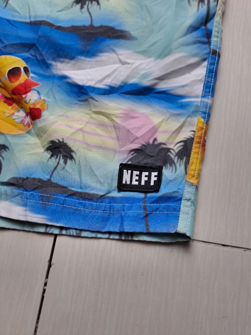 Neff Rubber Ducky Palm Tree Swim Trunks Large (Category: Swim Trunks & Board Shorts) located in General Santos City (Dadiangas). Submitted by shinra322 (Listing ID 1470379474, Image 3). Description: - Brand: Neff - Size: Large W32-36 L17.5 - Design: Blue and green tropical sunset with all-over rubber duckies in sunglasses and floral leis - Material: 100% polyester - Waistband: adjustable drawstring - Branding: Small black Neff logo patch on the l