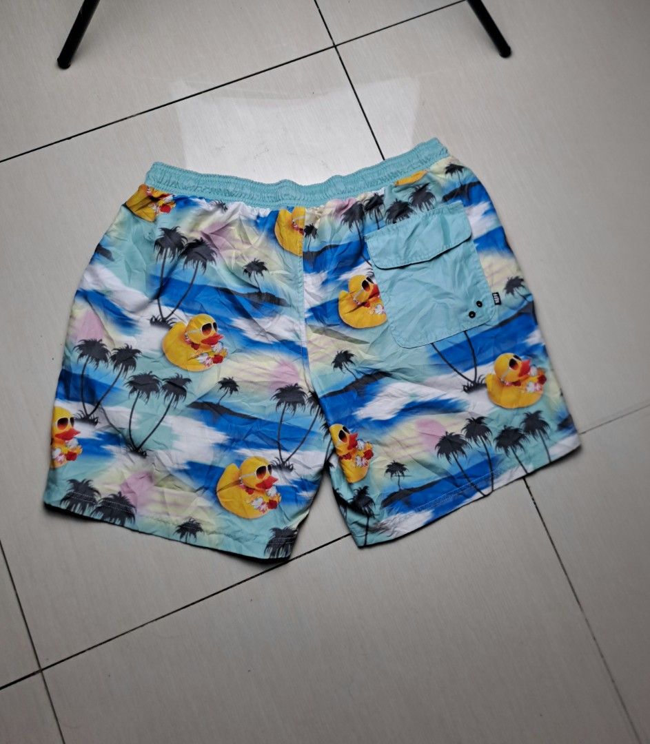 Neff Rubber Ducky Palm Tree Swim Trunks Large (Category: Swim Trunks & Board Shorts) located in General Santos City (Dadiangas). Submitted by shinra322 (Listing ID 1470379474, Image 2). Description: - Brand: Neff - Size: Large W32-36 L17.5 - Design: Blue and green tropical sunset with all-over rubber duckies in sunglasses and floral leis - Material: 100% polyester - Waistband: adjustable drawstring - Branding: Small black Neff logo patch on the l