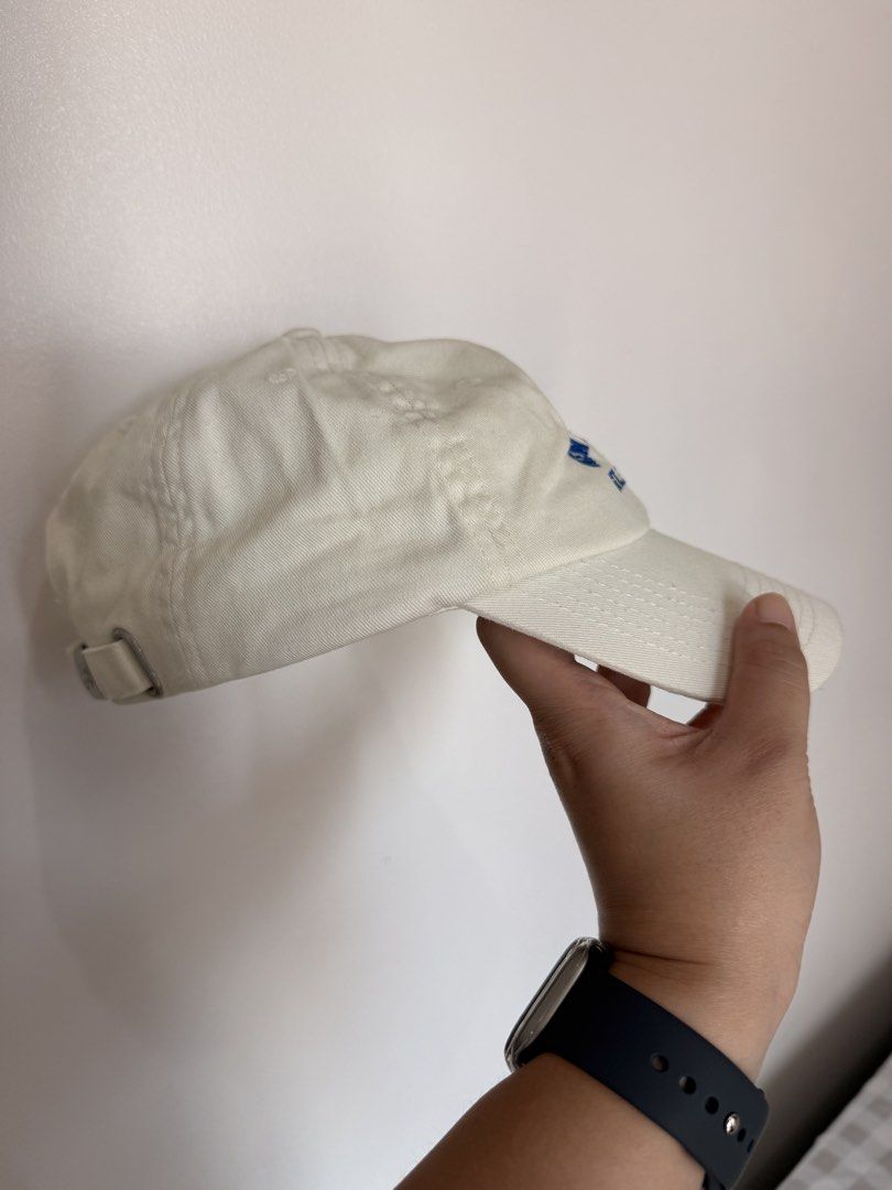 New Balance Athletic Dept Baseball Cap Off-White Blue (Category: Caps & Hats) located in Paranaque City. Submitted by mitchalc (Listing ID 1470370668, Image 2). Description: RFS: Don’t wear it anymore - Color: Off-white with blue embroidered 'New Balance Athletic Dept' lettering - Brand: New Balance - Closure: Adjustable strapback with NB branded metallic buckle - Details: Interior taped seams with repeated New Balance branding - Style: Clean, cl