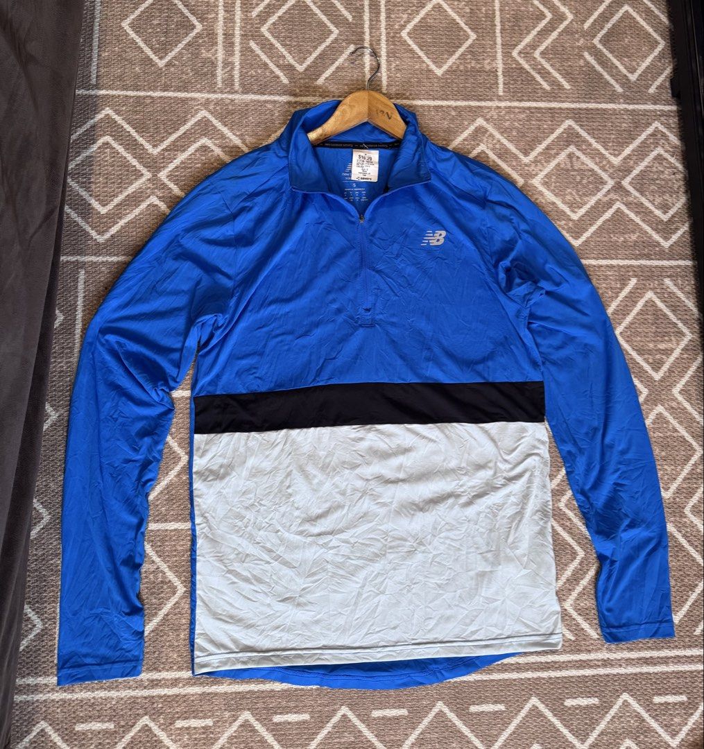 New Balance NB Dry Long Sleeve Activewear Pullover Size S (Category: Activewear) located in Bulacan. Submitted by zyannechlo86360 (Listing ID 1470364600, Image 1). Description: - Brand: New Balance - Style: Long sleeve athletic top with half-zip collar - Colorway: Blue, black, and light grey colorblock - Material: 87% polyester, 13% elastane with NB Dry technology - Size: Small (S) - Condition: Brand new with store tag attached 20x28 Excellenlt L