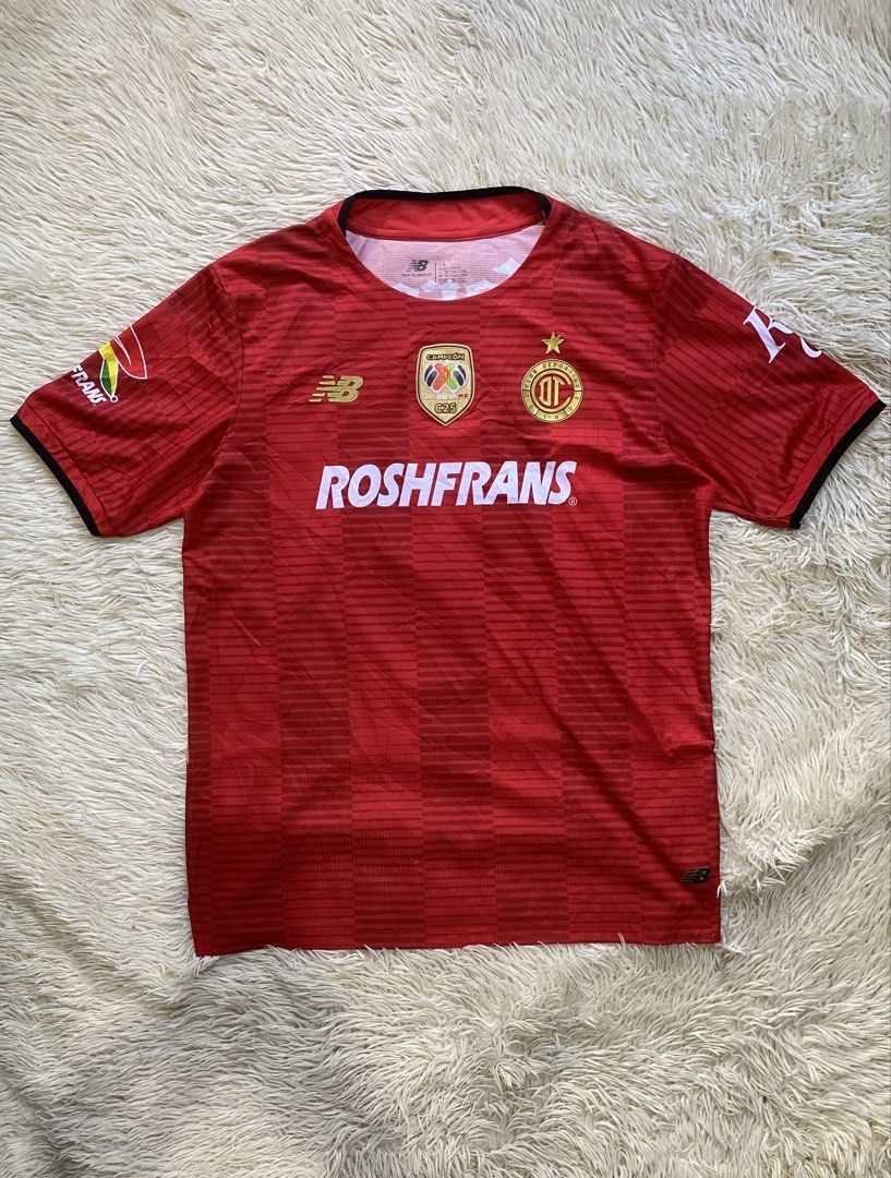 New Balance Toluca Home Jersey (Category: Activewear) located in Manila. Submitted by switchcity (Listing ID 1470409795, Image 1). Description: - Team: Deportivo Toluca (Home Jersey) - Brand: New Balance - Player Print: A. Vega #9 on the back - Size: Large - Condition/Material: 100% recycled polyester, red with subtle horizontal stripes - Features: Official Liga BBVA MX Campeón patch and sponsor logos (Roshfrans, Corona, Caliente).