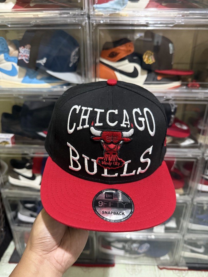 New Era 9Fifty Chicago Bulls Snapback Cap (Category: Caps & Hats) located in Manila. Submitted by batoy8814895 (Listing ID 1470432867, Image 1). Description: - Brand: New Era 9Fifty - Team: Chicago Bulls front embroidery - Colorway: Classic black crown with contrasting red flat brim - Condition: Brand new, unused with authentic visor sticker - Fit: Adjustable snap closure at the back - Style: Fresh shape and ready to wear.