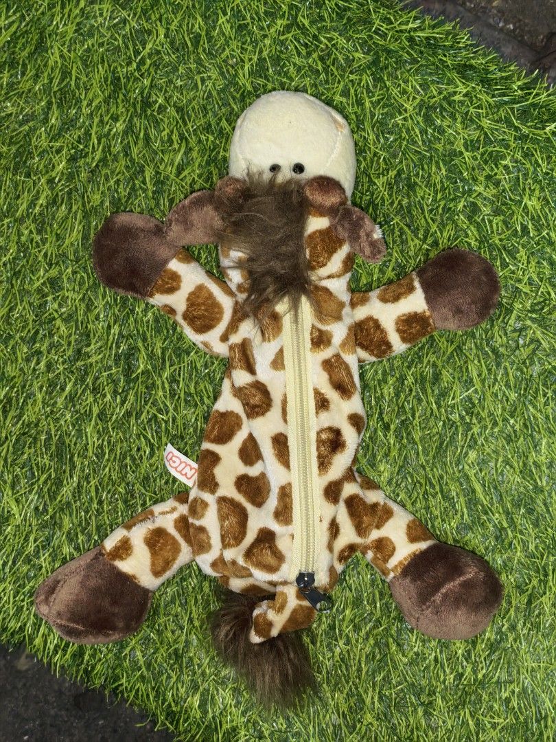 Nici Giraffe Plush Pencil Case (Category: Plushies & Soft Toys) located in Paranaque City. Submitted by furugiyafinds (Listing ID 1470455902, Image 1). Description: - Authentic Nici giraffe plush pencil case - Features cute brown spots and a fluffy mane - Secure zip closure along the front - Smooth golden-brown interior lining for pens and stationery - Soft and huggable plush material - Original Nici tag attached.