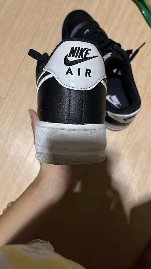 Nike Air Force 1 Black White Sneakers (Category: Sneakers) located in Sagñay. Submitted by goldenbird.261ce7 (Listing ID 1470514723, Image 2). Description: - Color: Black with white midsoles and contrast piping - Design: Classic low-top with black laces and embroidered Nike Air tongue branding - Material: Durable leather upper with a breathable perforated toe box - Fit: Standard fit - Condition/Usage: Versatile daily wear shoes, ready to ship!.