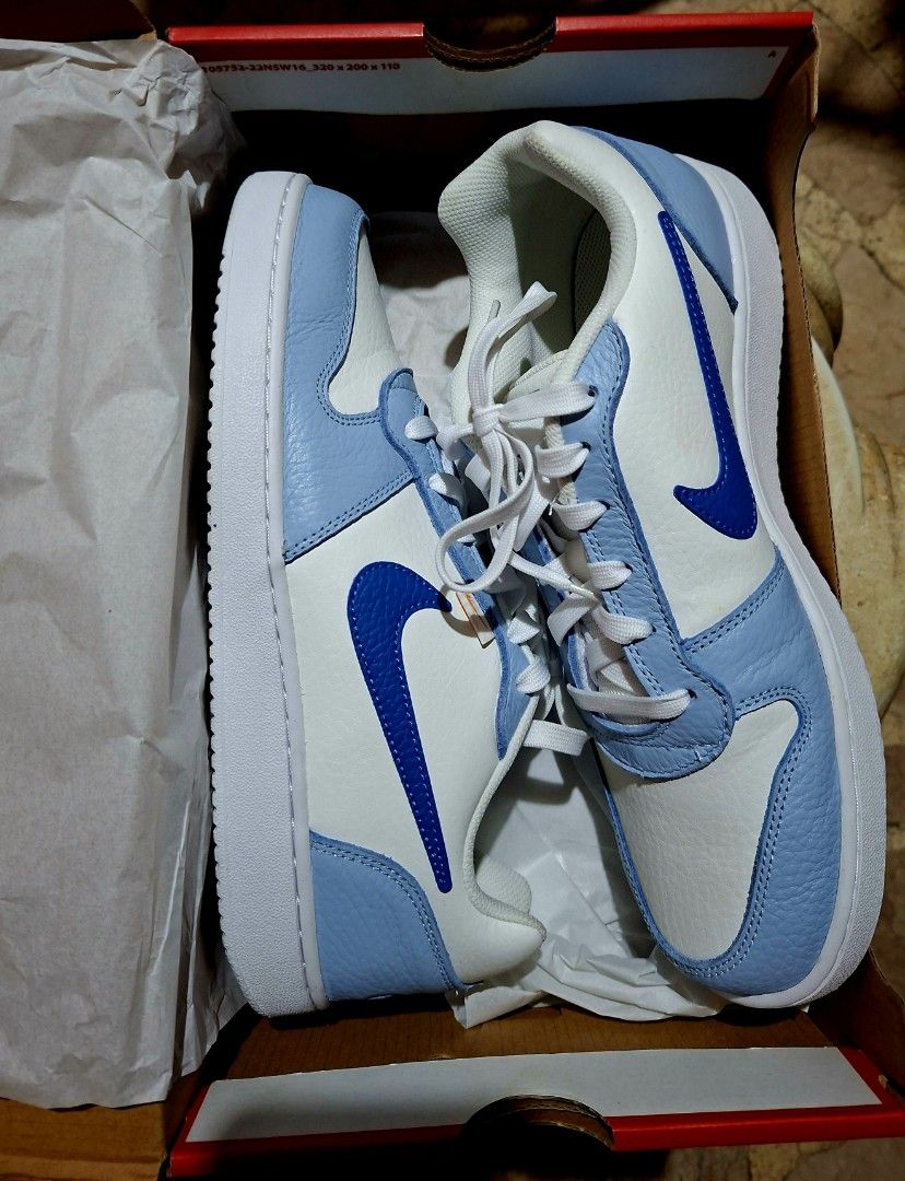 Nike Air Force 1 Low Light Blue White Sneakers (Category: Sneakers) located in Quezon City. Submitted by nobleriver_94656c (Listing ID 1470551626, Image 1). Description: - Brand new / Never worn / Pristine condition - Colorway: White tumbled leather with light blue overlays and royal blue swooshes - Includes original red Nike shoebox and tissue paper - 100% authentic - DM for inquiries, shipping, or meetup options.