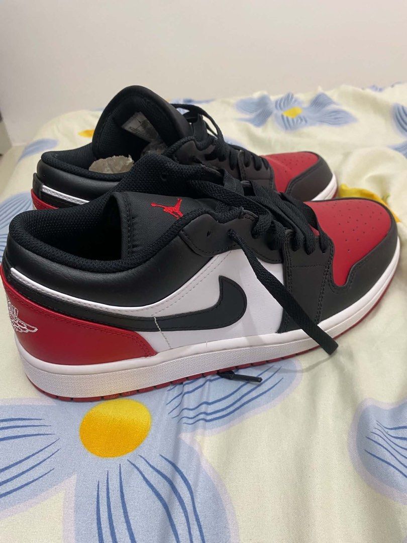 Nike Air Jordan 1 Low Black Red White (Category: Sneakers) located in Manila. Submitted by lucky_anton (Listing ID 1470473813, Image 3). Description: - Model: Air Jordan 1 Low - Colorway: Black / Gym Red / White (Bred Toe) - Design: Iconic Bred Toe blocking with black overlays, red toe box/heel, and white side panels - Branding: Classic Jumpman tongue branding and embroidered heel Wings logo - Soles: Clean white midsole with a durable red outsole
