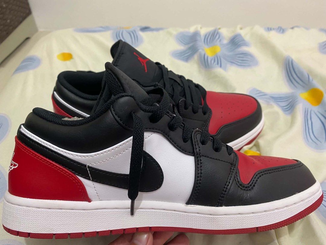 Nike Air Jordan 1 Low Black Red White (Category: Sneakers) located in Manila. Submitted by lucky_anton (Listing ID 1470473813, Image 2). Description: - Model: Air Jordan 1 Low - Colorway: Black / Gym Red / White (Bred Toe) - Design: Iconic Bred Toe blocking with black overlays, red toe box/heel, and white side panels - Branding: Classic Jumpman tongue branding and embroidered heel Wings logo - Soles: Clean white midsole with a durable red outsole