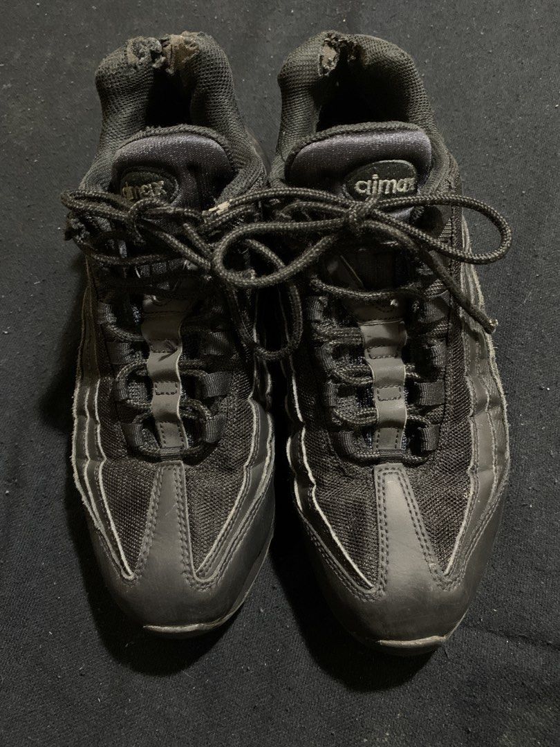 Nike Air Max 95 Triple Black Size 10.5 (Category: Sneakers) located in Cagayan de Oro. Submitted by chabermz (Listing ID 1470533166, Image 2). Description: - Brand/Model: Nike Air Max 95 Triple Black - Size: US 10.5 / EUR 44.5 - Design: Iconic layered upper with mesh and synthetic materials, featuring responsive Air units - Condition Notes: Substantial wear on inner ankle collars with fabric tearing on both shoes - Cosmetic Wear: Scuffs and fadin
