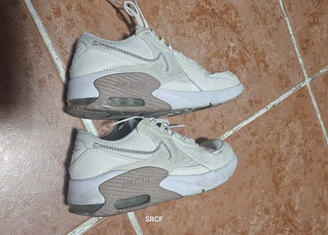 Nike Air Max Sneakers Size 3.5Y (Category: Babies & Kids Fashion) located in Quezon City. Submitted by geminimomma2 (Listing ID 1470358051, Image 2). Description: - Brand/Model: Nike Air Max (Style: FB3058-107) - Colorway: White and Taupe - Size: US 3.5Y / UK 3 / EUR 35.5 / CM 22.5 - Design: Classic lace-up with visible air cushion sole - Condition: Pre-owned with normal creasing and major scuffs on the upper; visible wear on the soles and inner 
