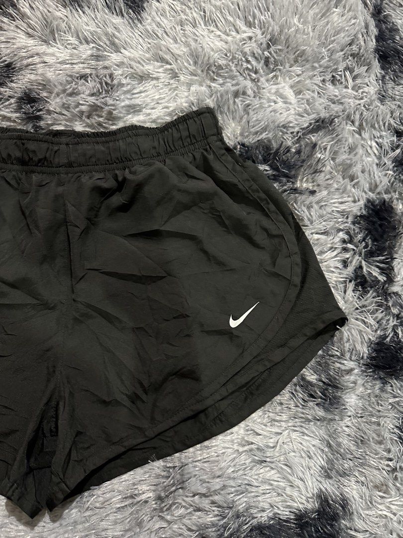 Nike Black Athletic Shorts (Category: Activewear) located in Iba. Submitted by thriftcoyan (Listing ID 1470490594, Image 2). Description: - Brand: Nike -Size 28-31 -Length 10 - Color: Classic black - Design: White Nike Swoosh logo on lower right leg - Comfort: Elastic waistband with comfy stretch and inner brief lining - Material: Lightweight fabric, ideal for workouts or casual lounging - Condition: cut tag pero excellent condition.