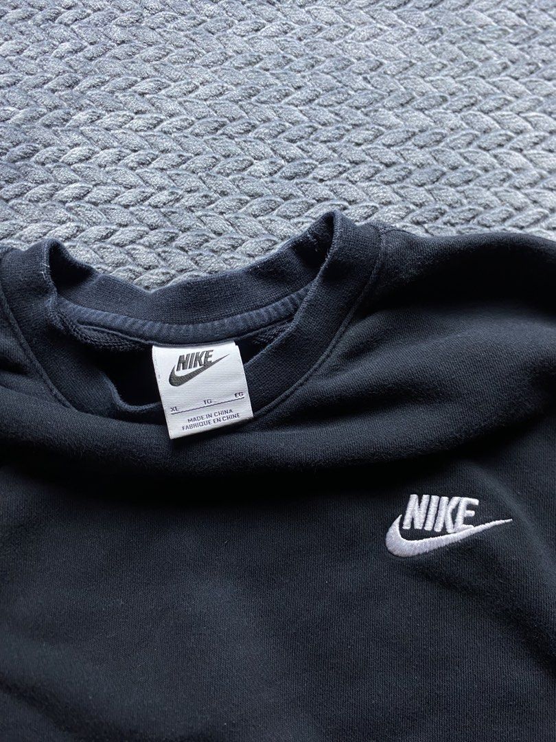 Nike Black Crewneck Sweatshirt (Category: Coats, Jackets and Outerwear) located in Olongapo. Submitted by WAVYT (Listing ID 1470552408, Image 2). Description: - Brand: Nike - Style/Model: BV2667-010 - Color: Black with embroidered white logo - Size: XL - Fit: Classic pullover with ribbed cuffs and hem - Material: Comfortable everyday wear - Condition: Excellent / Pre-loved - Origin: Made in China - Shipping: Nationwide via J&T or LBC - Meet-ups: 