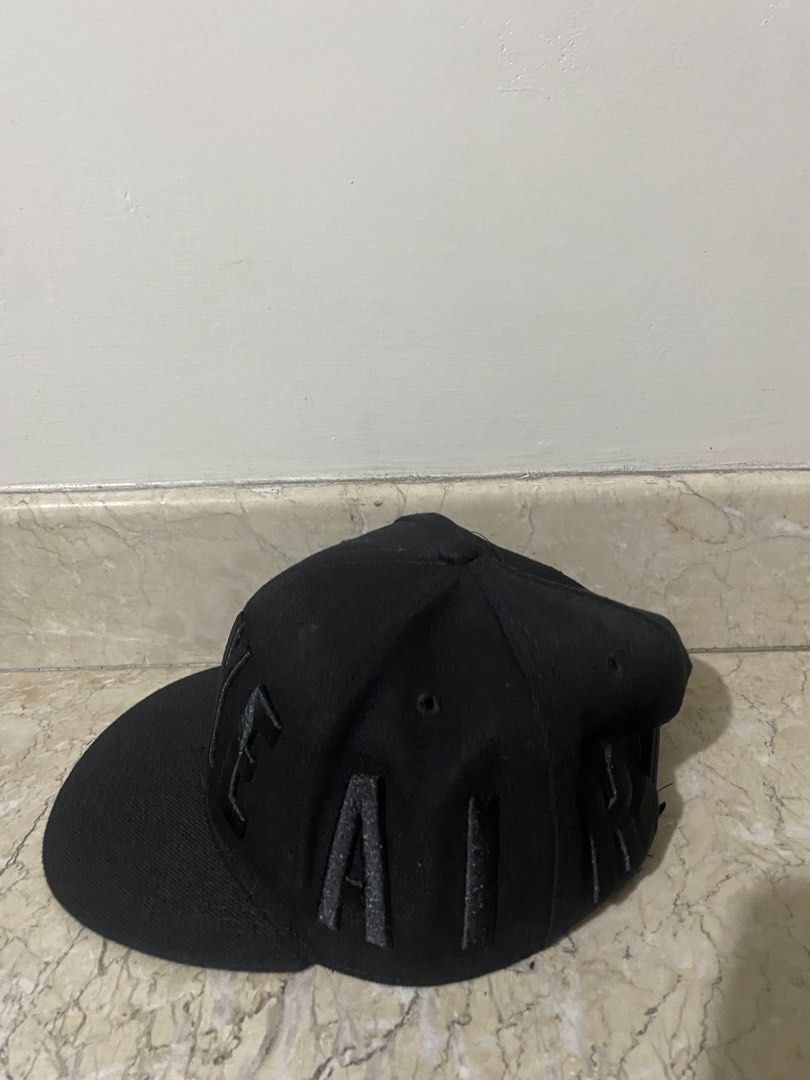 Nike Black Flat Brim Cap with Raised Letters (Category: Caps & Hats) located in Manila. Submitted by primomirp (Listing ID 1470458054, Image 2). Description: - Brand: Nike - Style: Flat brim snapback cap - Color: Black with large raised block letters wrapping around - Details: Interior taped seams with 'Engineered to the exact specifications of championship athletes' - Closure: Adjustable snapback - Condition: Clean inside and out, minimal wear.