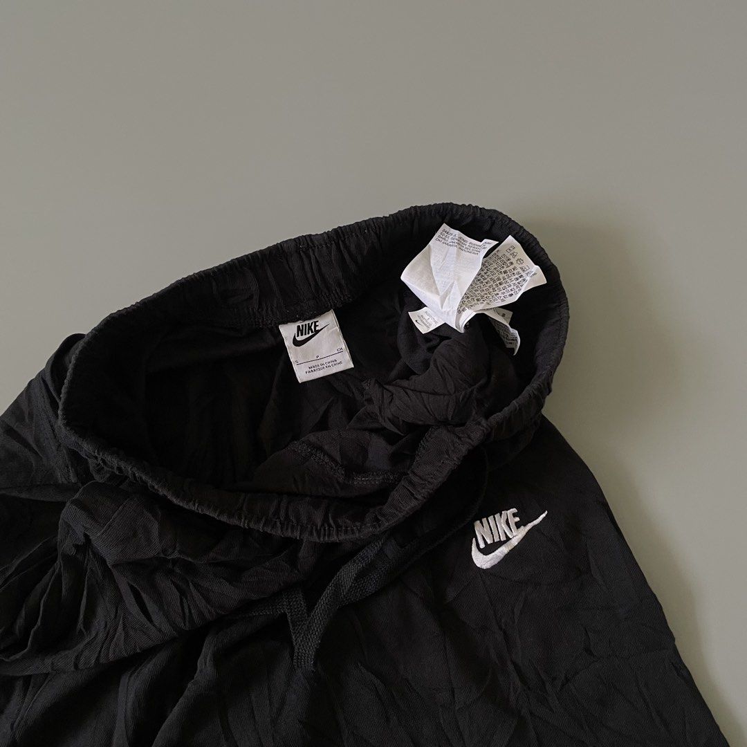 Nike Black Shorts Drawstring Waist (Category: Shorts) located in Manila. Submitted by allthrift07 (Listing ID 1470401267, Image 2). Description: - Color: Classic Black - Material: Soft, breathable cotton - Features: Elastic drawstring waist & white embroidered Nike logo - Condition: Brand new with interior care tags and Nike size label - Origin: Made in China - Versatile: Ideal for workouts, sports, or relaxing at home.