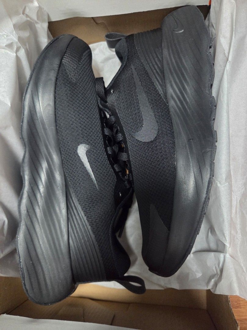 Nike Black Sneakers with Tag (Category: Sneakers) located in Manila. Submitted by anneclariceyanga (Listing ID 1470517038, Image 2). Description: Available size Women- 8, 8.5, 9 Men- 8.5 - Brand: Nike - Color: Black - Condition: Brand new, never worn outside (with original box) - Material: Breathable mesh upper with a thick sculpted sole - Features: Original laces attached, brown tag still on the shoe, completely clean sole and fabric.