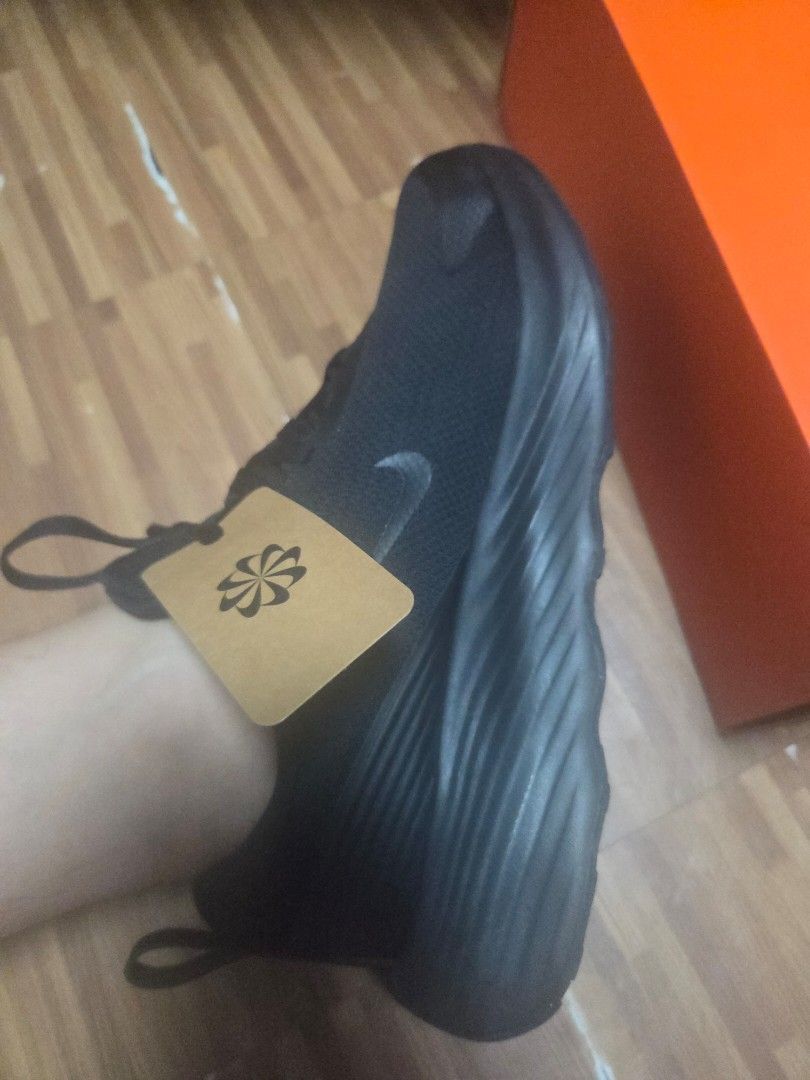 Nike Black Sneakers with Tag (Category: Sneakers) located in Manila. Submitted by anneclariceyanga (Listing ID 1470517038, Image 1). Description: Available size Women- 8, 8.5, 9 Men- 8.5 - Brand: Nike - Color: Black - Condition: Brand new, never worn outside (with original box) - Material: Breathable mesh upper with a thick sculpted sole - Features: Original laces attached, brown tag still on the shoe, completely clean sole and fabric.