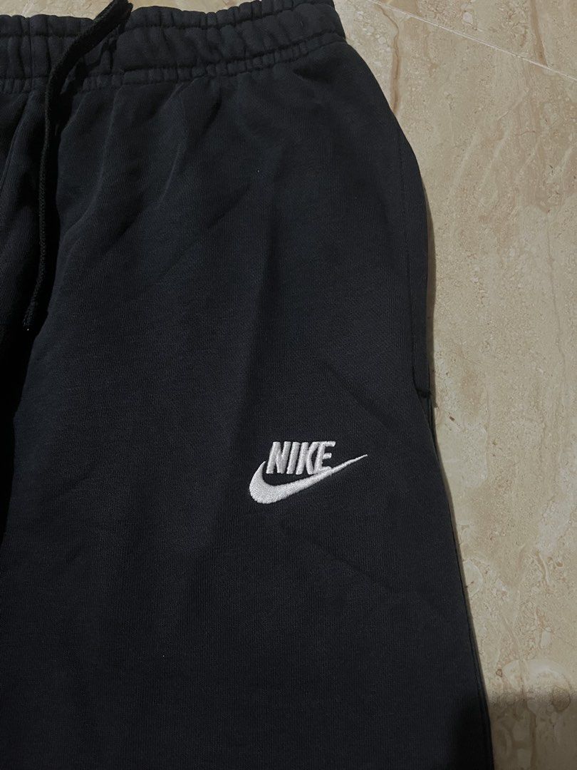 Nike Black Sweatpants Joggers Size L (Category: Joggers) located in Manila. Submitted by aaronlarsk00485 (Listing ID 1470465266, Image 3). Description: - Color: Black - Size: L, Waist-28-33 L- 38 - Material: 80% cotton, 20% polyester blend - Fit: Straight leg cut with adjustable drawstring waistband - Design: Embroidered white Nike logo on left thigh - Storage: Two functional side pockets - Origin: Made in China - Condition: Brand new / Excellent