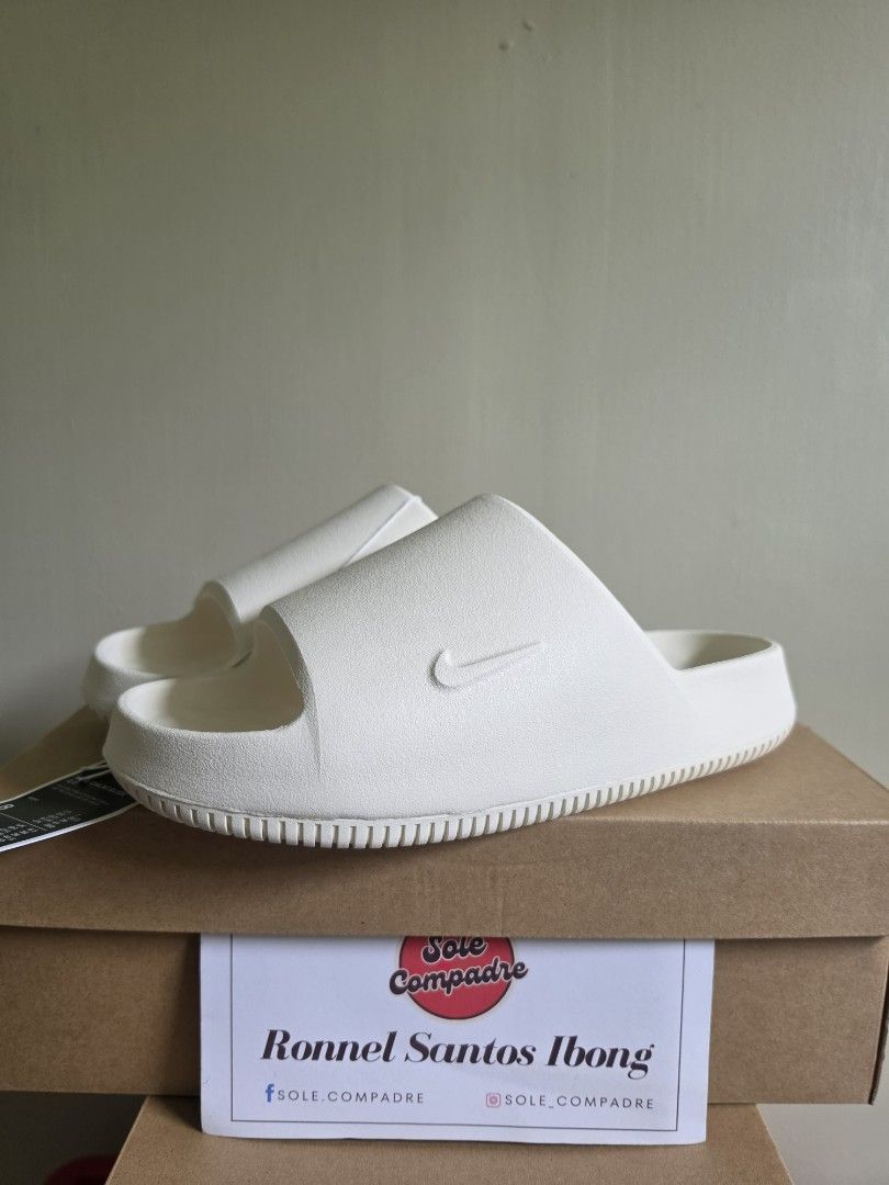 Nike Calm Slide "Sail" (Category: Slippers & Slides) located in Cavite. Submitted by sole.compadre (Listing ID 1470482435, Image 1). Description: WTS / SELLING Nike Calm Slide "Sail" size 8, 9 & 10 men's Brand New ✅ Authentic 💯 BELOW SRP (srp:₱2,595) Now: ₱1,500 only.