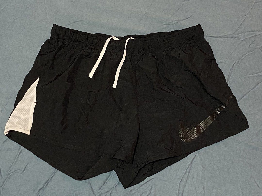 Nike Dri-FIT Black Running Shorts Size M (Category: Shorts) located in Cagayan de Oro. Submitted by ohh-kay (Listing ID 1470391180, Image 2). Description: - Brand: Nike - Item: Dri-FIT Running Shorts - Color: Black - Size: Medium / 26-30 waist / length 10” - Material: 100% recycled polyester (lightweight and breathable) - Features: Elastic waistband with white adjustable drawstring, white mesh side panels - Condition: Clean, excellent overall con