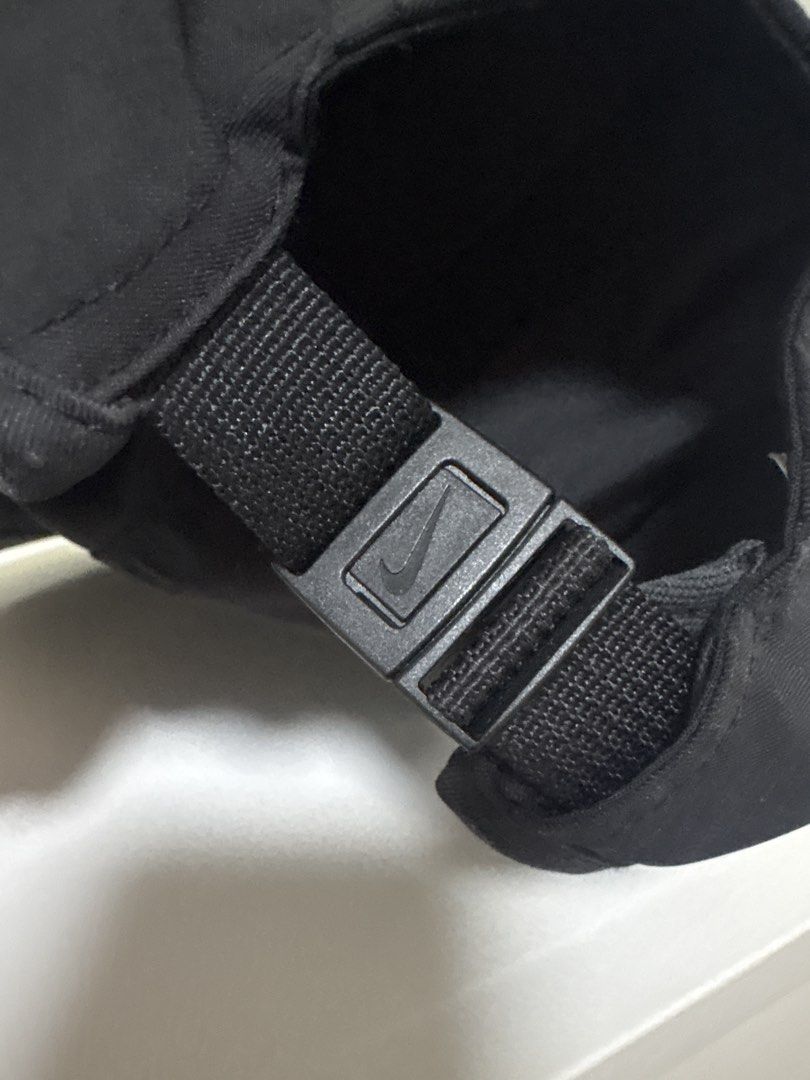 Nike Dri-FIT Fly Cap Black L/XL (Category: Caps & Hats) located in Brookes Point. Submitted by tntkicks (Listing ID 1470360088, Image 2). Description: - Brand: Nike - Model: Dri-FIT Fly Cap - Color: Black - Size: L/XL - Material: Lightweight, breathable polyester with Dri-FIT moisture-wicking technology - Design: White embroidered Swoosh on the front panel - Closure: Adjustable strapback with a debossed Nike Swoosh metal buckle - Condition: Clean