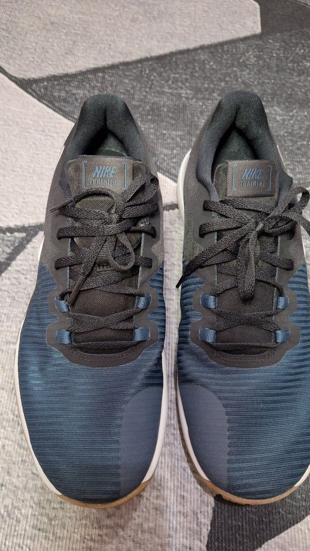 Nike Flex Training Sneakers Blue Black US 11 (Category: Sneakers) located in Mandaluyong City. Submitted by erick1213_ (Listing ID 1470501234, Image 1). Description: - Brand: Nike - Style: Training shoes - Colorway: Dark Blue and Black with White midsole - Size: US 11 / UK 10 / EUR 45 / 29 cm - Outsole: Textured gum and durable black rubber - Details: Lace-up closure with blue eyelet loops, Nike Flex heel branding, and Nike Training tongue tag - 