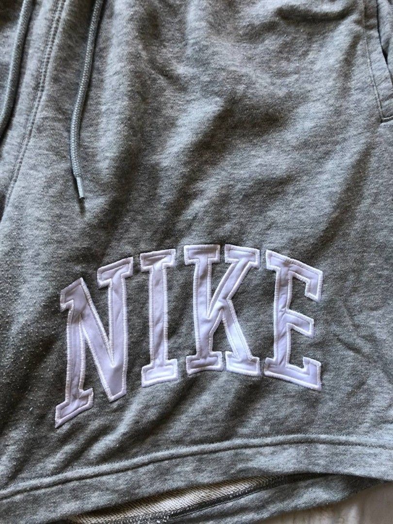 Nike french terry shorts (Category: Shorts) located in Romblon. Submitted by teppthrift. (Listing ID 1470422498, Image 3). Description: - Brand: Nike - Model: FQ4093-063 - Size: XXL - Color: Grey - Material: 80% cotton, 20% polyester fleece - Details: Thick embroidered Nike lettering on the left leg, elastic waistband with adjustable drawstrings - Pockets: Convenient side pockets plus one back pocket with a button closure - Fit: Relaxed fit, supe