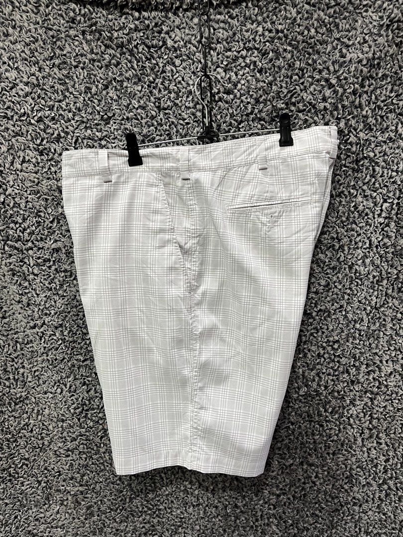 Nike Golf Dri-FIT plaid performance shorts | Size 36 (Category: Shorts) located in General Trias. Submitted by zrchustle.604 (Listing ID 1470498205, Image 3). Description: Nike Golf Dri-FIT plaid performance shorts, featuring a light grey and white checkered pattern, rear welt pockets, and the classic embroidered Nike Swoosh above the back-right pocket..