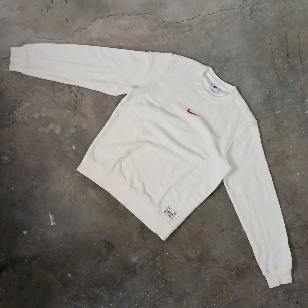 Nike Just Do It Cream Crewneck Sweatshirt (Category: Coats, Jackets and Outerwear) located in Manila. Submitted by joefrey12 (Listing ID 1459378922, Image 2). Description: - Cream Nike crewneck sweatshirt - Tagged size L 22x26 - Small red swoosh logo on the front - Back graphic: 'JUST DO IT. THERE IS NO FINISH LINE' - Ideal for casual and everyday wear.