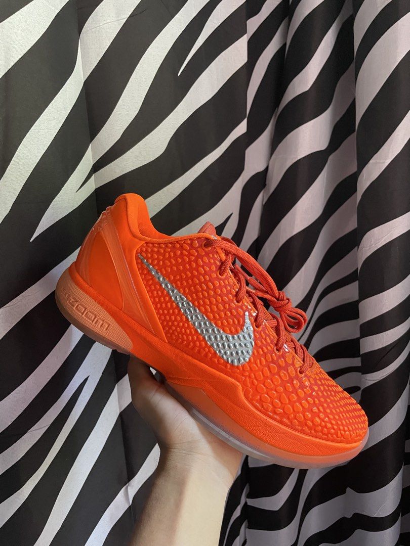 Nike Kobe 6 Protro Orange (Category: Sneakers) located in San Pedro. Submitted by mharemilvalencia (Listing ID 1470506876, Image 2). Description: - Model: Nike Kobe 6 Protro -used 3x Complete - Colorway: Vibrant Orange with Silver Swoosh - Design: Iconic snakeskin texture upper and signature Kobe branding on tongue and outsole - Sole: Translucent orange rubber sole with high-performance traction pattern - Packaging: Includes original shoe box - C