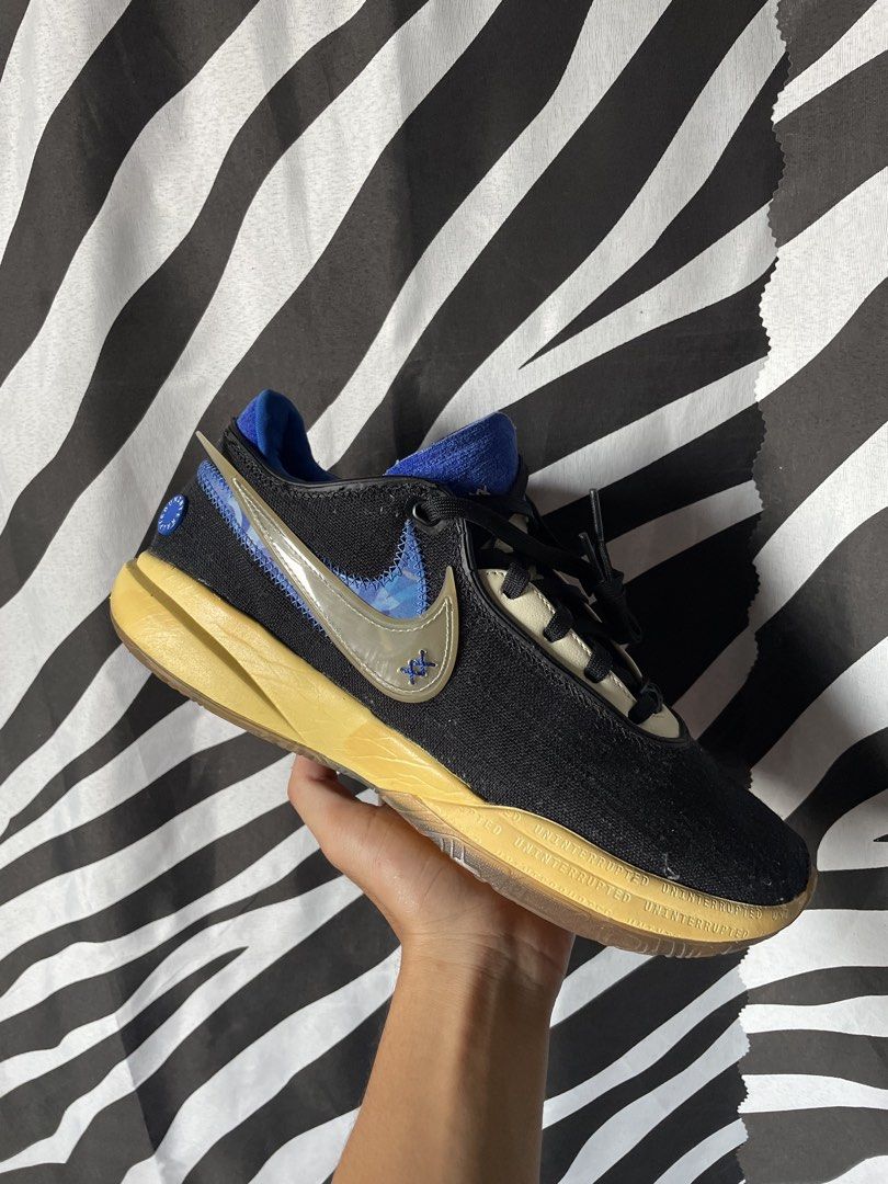 Nike LeBron 20 “Uninterrupted”EP Black Blue (Category: Sneakers) located in San Pedro. Submitted by mharemilvalencia (Listing ID 1470533453, Image 3). Description: - Authentic Lebron 20 “Uninterrupted”collaboration sneakers - Black canvas upper featuring a vibrant blue inner lining and translucent double swoosh - Yellow-tinted midsole with signature UNINTERRUPTED branding text - Durable gum rubber outsole with circular traction for maximum grip -