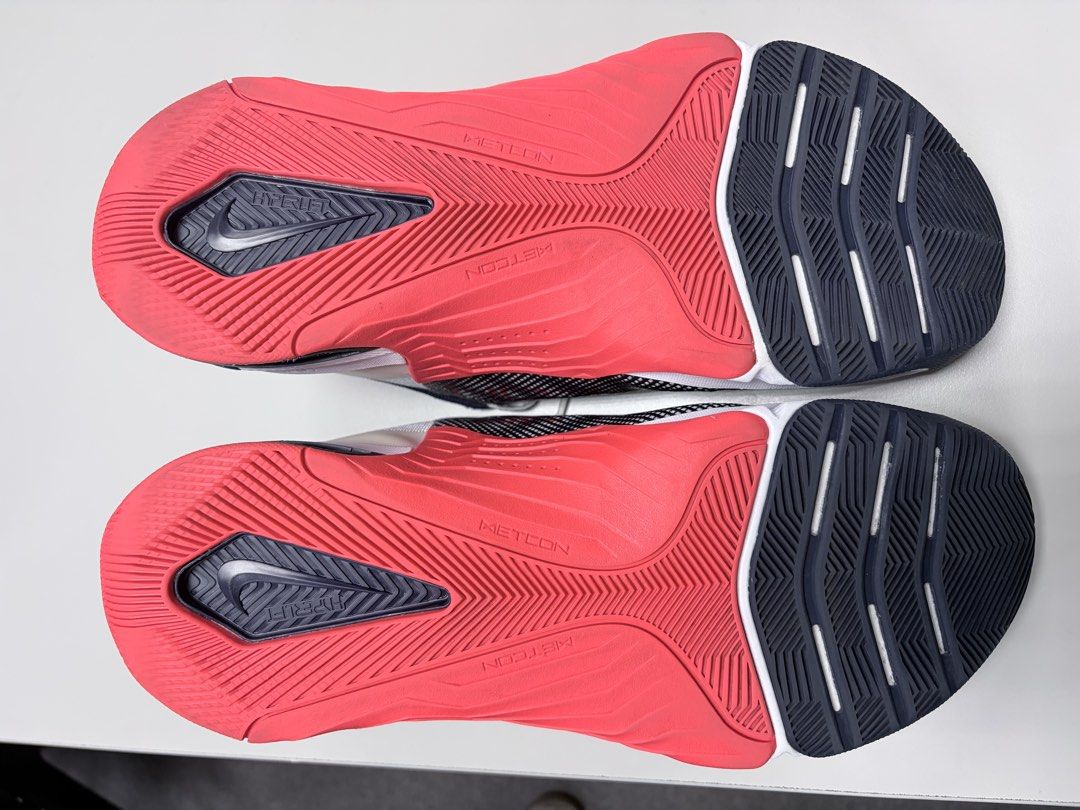 Nike Metcon 8 Training Shoes Size US 9 (Category: Sneakers) located in Mandaluyong City. Submitted by juliansthings (Listing ID 1470373216, Image 3). Description: - Brand/Model: Nike Metcon 8 trainers - Colorway: White, navy, and pink - Size: US 9 / EUR 42.5 - Performance: Cushioned React foam midsole with Hyperlift heel plate for ultimate stability - Durability: Grid mesh upper with reinforced side wraps for heavy lifting and cross-training - Co