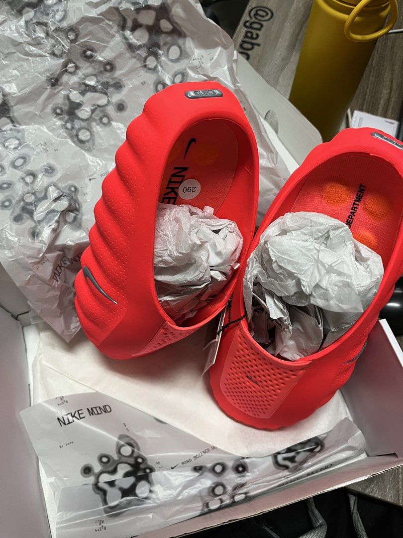 Nike Mind 001 Solar Red Slides (Category: Slippers & Slides) located in Manila. Submitted by notnathan_xy (Listing ID 1470362317, Image 2). Description: - Brand: Nike Mind 001 slides - Color: Solar Red / Chrome Hyper Crimson - Size: 11 US / 29 cm - Condition: Brand new with original tags attached - Design: Textured upper with perforated detailing and chunky podular sole - Inclusion: Complete with original box and packaging paper.