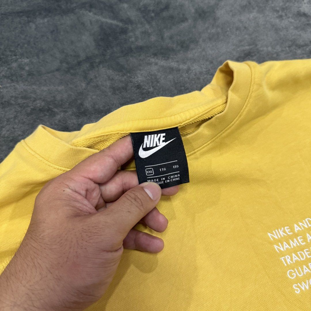 NIKE NSW DOUBLE SWOOSH CREW NECK (Category: Activewear) located in Santa Maria. Submitted by rarefindslt (Listing ID 1470520586, Image 2). Description: NIKE NSW DOUBLE SWOOSH CREW NECK (SWIPE LEFT FOR MORE DETAILS..) Size XXL on tag in solid good condition rate! complete tags for authenticity, solid yellow condition color rate, embroidered swoosh script on sleeve, double swoosh on other side, nike sportswear script, can pass as new! no issue.