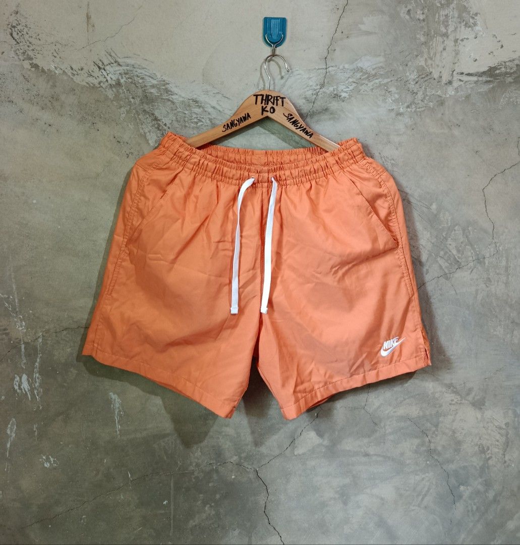 Nike Orange Shorts Size M (Category: Shorts) located in Kalamansig. Submitted by skone1996 (Listing ID 1470431033, Image 1). Description: - Brand: Nike - Color: Bright Orange - Size: Men's Medium - 28-32 Waistline - 16.5 Length - 10/10 Color rate - No issue - Condition: Clean, like-new with no flaws - Features: Elastic waistband with white drawstring, breathable mesh lining, two side pockets - Details: Small embroidered white Nike logo on the bot