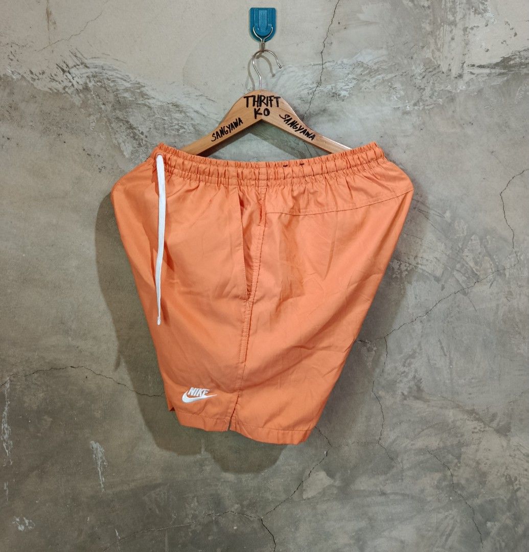 Nike Orange Shorts Size M (Category: Shorts) located in Kalamansig. Submitted by skone1996 (Listing ID 1470431033, Image 2). Description: - Brand: Nike - Color: Bright Orange - Size: Men's Medium - 28-32 Waistline - 16.5 Length - 10/10 Color rate - No issue - Condition: Clean, like-new with no flaws - Features: Elastic waistband with white drawstring, breathable mesh lining, two side pockets - Details: Small embroidered white Nike logo on the bot