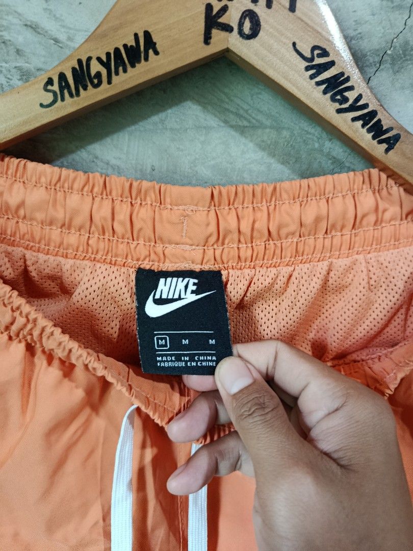 Nike Orange Shorts Size M (Category: Shorts) located in Kalamansig. Submitted by skone1996 (Listing ID 1470431033, Image 3). Description: - Brand: Nike - Color: Bright Orange - Size: Men's Medium - 28-32 Waistline - 16.5 Length - 10/10 Color rate - No issue - Condition: Clean, like-new with no flaws - Features: Elastic waistband with white drawstring, breathable mesh lining, two side pockets - Details: Small embroidered white Nike logo on the bot