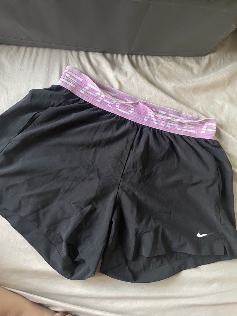 Nike Pro Dri-FIT Shorts (Category: Activewear) located in Muntinlupa City. Submitted by afs77 (Listing ID 1470443260, Image 1). Description: - Brand: Nike Pro - Size: Medium - Color: Black with purple elastic waistband - Material: Dri-FIT (moisture-wicking) - Condition: Great for running, gym sessions Location: Filinvest city, Alabang.