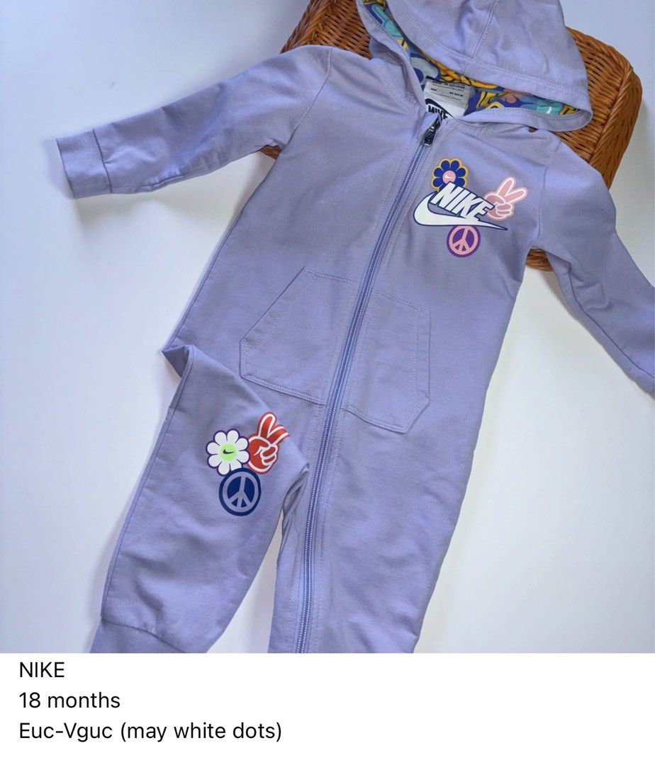 Nike Purple Hooded Romper 18 Months (Category: Babies & Kids Fashion) located in Manila. Submitted by miamoire (Listing ID 1470556375, Image 1). Description: - Brand: Nike - Size: 18 months - Color: Pastel purple with colorful retro floral and peace sign graphics - Material: Soft and cozy fleece - Features: Full front zipper for easy dressing, front kangaroo pockets, and patterned hood lining - Condition: Great pre-loved condition (ready to wear!