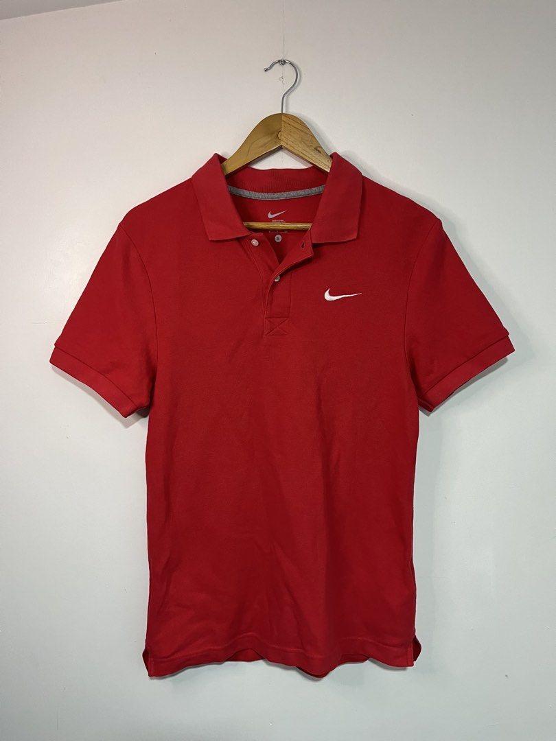 Nike Red Polo Shirt Size S (Category: Tshirts & Polo Shirts ) located in Dasmarinas. Submitted by thriftedbygii (Listing ID 1470532985, Image 1). Description: - Brand: Nike - Color: Red - Size: Small (S) - Material: Soft and breathable pique cotton - Design: Classic collar with two-button placket - Logo: Iconic embroidered white Swoosh on the chest - Condition: Clean, well-maintained, tag still intact inside the collar - Style: Great for daily we
