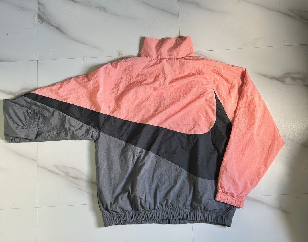 Nike Sportswear Windrunner Jacket Pink Grey Size L (Category: Coats, Jackets and Outerwear) located in Cavite. Submitted by remcadzzz (Listing ID 1470426481, Image 2). Description: - Brand: Nike - Style: Colorblock Windrunner Jacket (AR3133-668) - Colorway: Pink, black, and grey with classic chevron design - Size: Large (Standard fit) - Features: Full zip closure, stand collar, and breathable mesh lining - Origin: Made in Vietnam - Excellent Cond