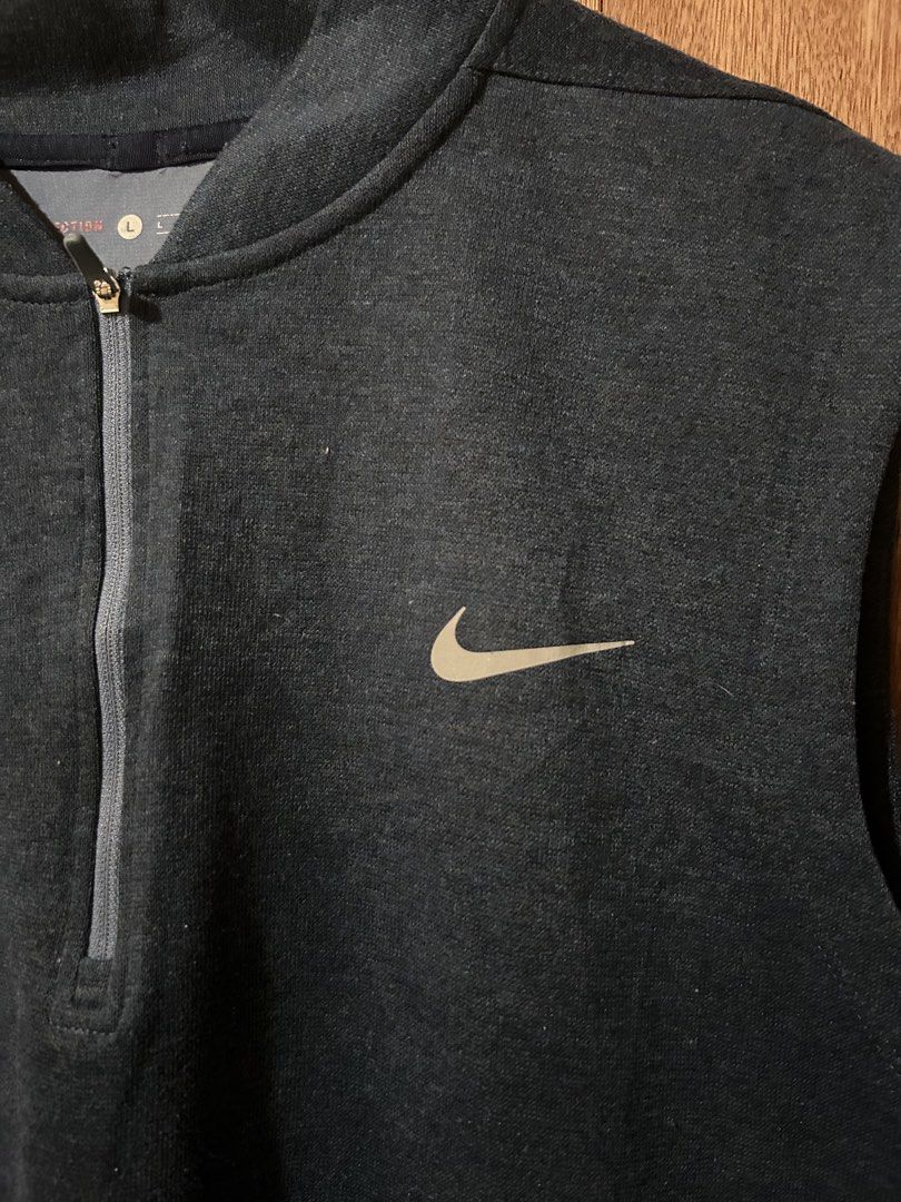 Nike Tiger Woods Collection Half Zip Golf Vest (Category: Vests) located in Cabiao. Submitted by alldaythrift (Listing ID 1470504308, Image 3). Description: - Brand: Nike (Tiger Woods Collection) - Item: Sleeveless half-zip vest / mock collar - Color: Navy blue with white Swoosh and TW logo - Size: Large - Material: Lightweight fabric with comfortable stretch - Condition: Excellent layering piece for golf or casual wear - Origin: Made in Thailand