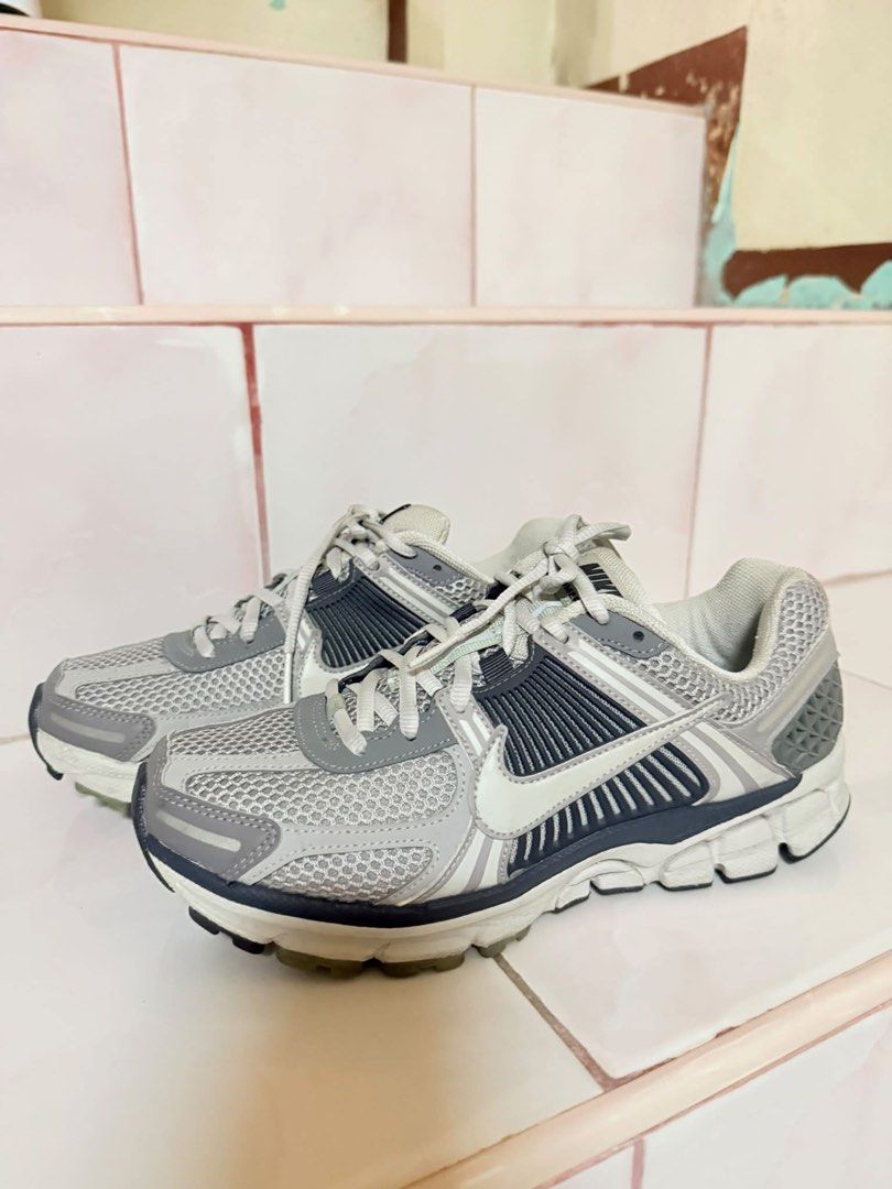 Nike Vomero 5 (Category: Sneakers) located in Manila. Submitted by diannenjs (Listing ID 1470513609, Image 1). Description: - Model: Nike Vomero 5 (Grey) - Size: 7 womens - Condition: Clean pair, minimal wear visible - Features: Mesh and synthetic upper, cushion foam midsole, textured rubber outsole, and graphic insole - Perfect for daily wear and running.