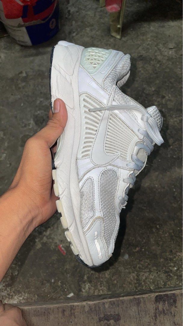 Nike Vomero 5 White Sneakers (Category: Sneakers) located in Manila. Submitted by chawmichael (Listing ID 1470506712, Image 1). Description: - Model: Nike Zoom Vomero 5 - Colorway: White and Sail - Features: Breathable mesh upper, supportive plastic side cages, Cushlon midsole with Zoom Air cushioning - Style: Classic chunky retro running silhouette, perfect for everyday wear - Condition: Normal signs of wear around the sole edges and mesh, still
