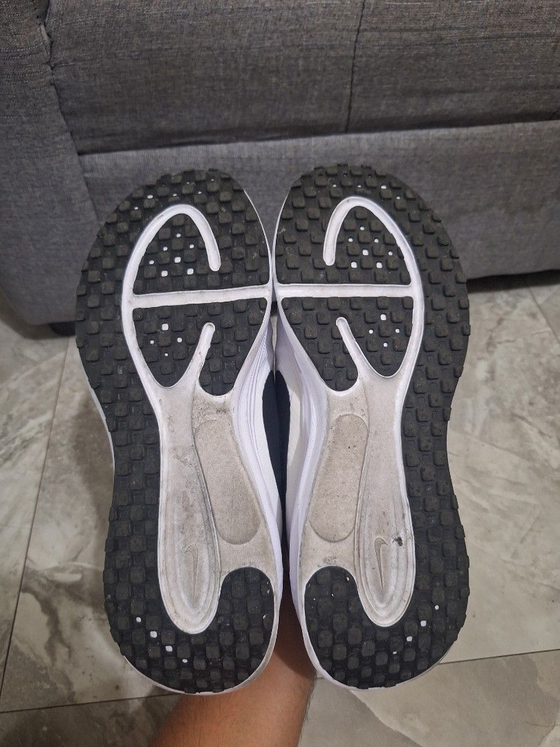 Nike White Slip-on Sneakers (Category: Sneakers) located in Manila. Submitted by slickeryslickslick (Listing ID 1470508833, Image 3). Description: - Material: Breathable mesh upper with a textured rubber outsole for reliable grip and take off for daily casual wear. - Condition: Normal yellowing staines due to long term storage..