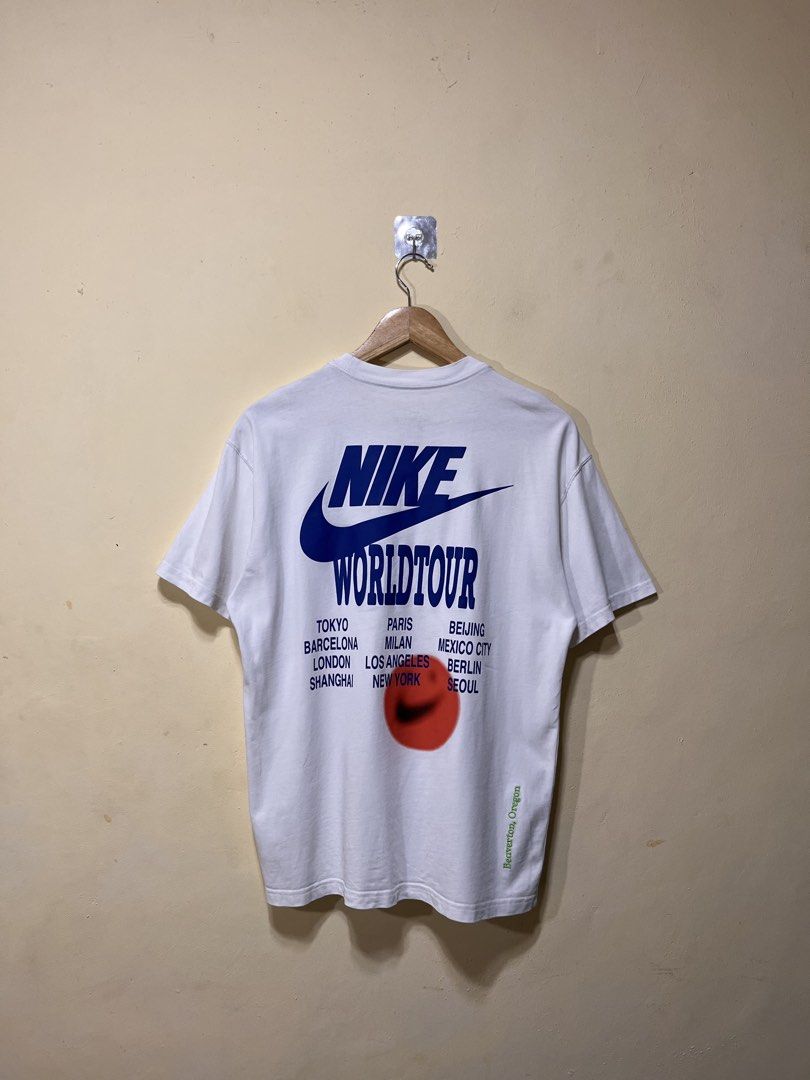 Nike World Tour Tshirt (Category: Activewear) located in Naga. Submitted by davinci_25 (Listing ID 1470440493, Image 1). Description: dimes: 20 width x 27 length issue: none condition: like new condition (9.9/10) color rate: 9.9/10.