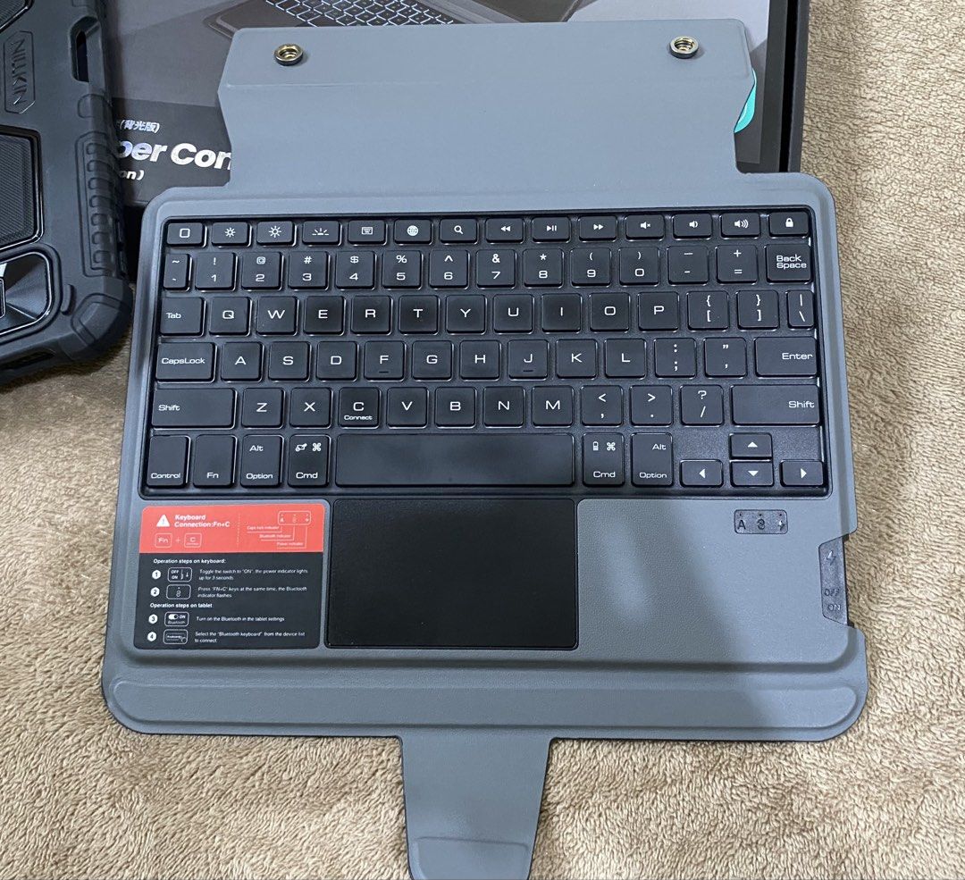 Nillkin Combo Keyboard Case (Category: Computer Keyboard) located in San Juan City. Submitted by selaina (Listing ID 1470418271, Image 2). Description: - Fits iPad 11-inch A16 - Detachable Keyboard - Case with stand - Sliding camera cover - Backlit keyboard - complete with box and charger cable.