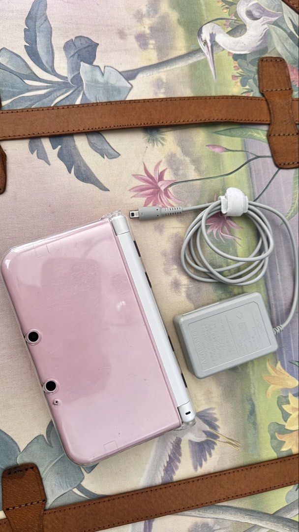 Nintendo Pink 3DS XL (Category: Other Mobile & Gadget Accessories) located in Imus. Submitted by pocketfullofcandies (Listing ID 1470364893, Image 1). Description: Color is white pink with white coral. With original pen, working properly. Already have games installed. .