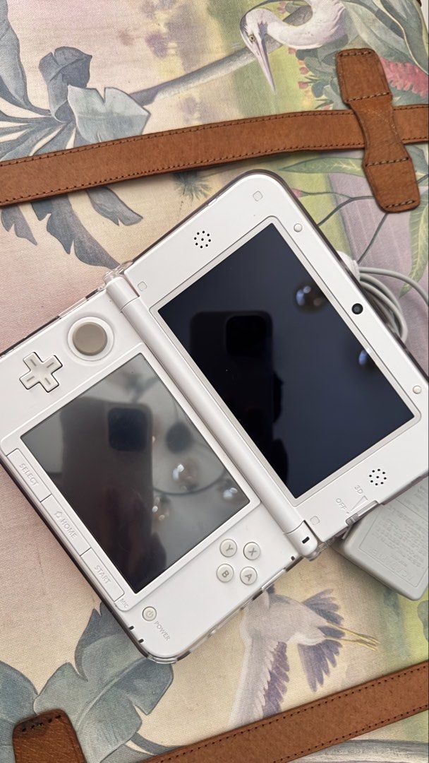 Nintendo Pink 3DS XL (Category: Other Mobile & Gadget Accessories) located in Imus. Submitted by pocketfullofcandies (Listing ID 1470364893, Image 2). Description: Color is white pink with white coral. With original pen, working properly. Already have games installed. .