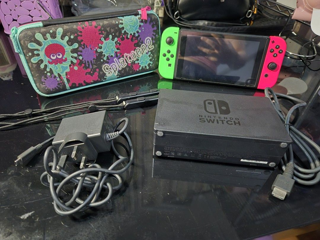 Nintendo Switch Console with Splatoon 2 Carrying Case and Accessories (Category: Nintendo) located in Muntinlupa City. Submitted by el_dritchknight (Listing ID 1470424081, Image 2). Description: Nintendo Switch (Original Model) – Neon Pink/Green Joy-Con, Complete Set With Box PHP 12,500 (negotiable) Fully working Nintendo Switch, original model, with neon green/pink Joy-Con. Complete set: – Console + Joy-Con pair + straps – Dock, HDMI cable, char