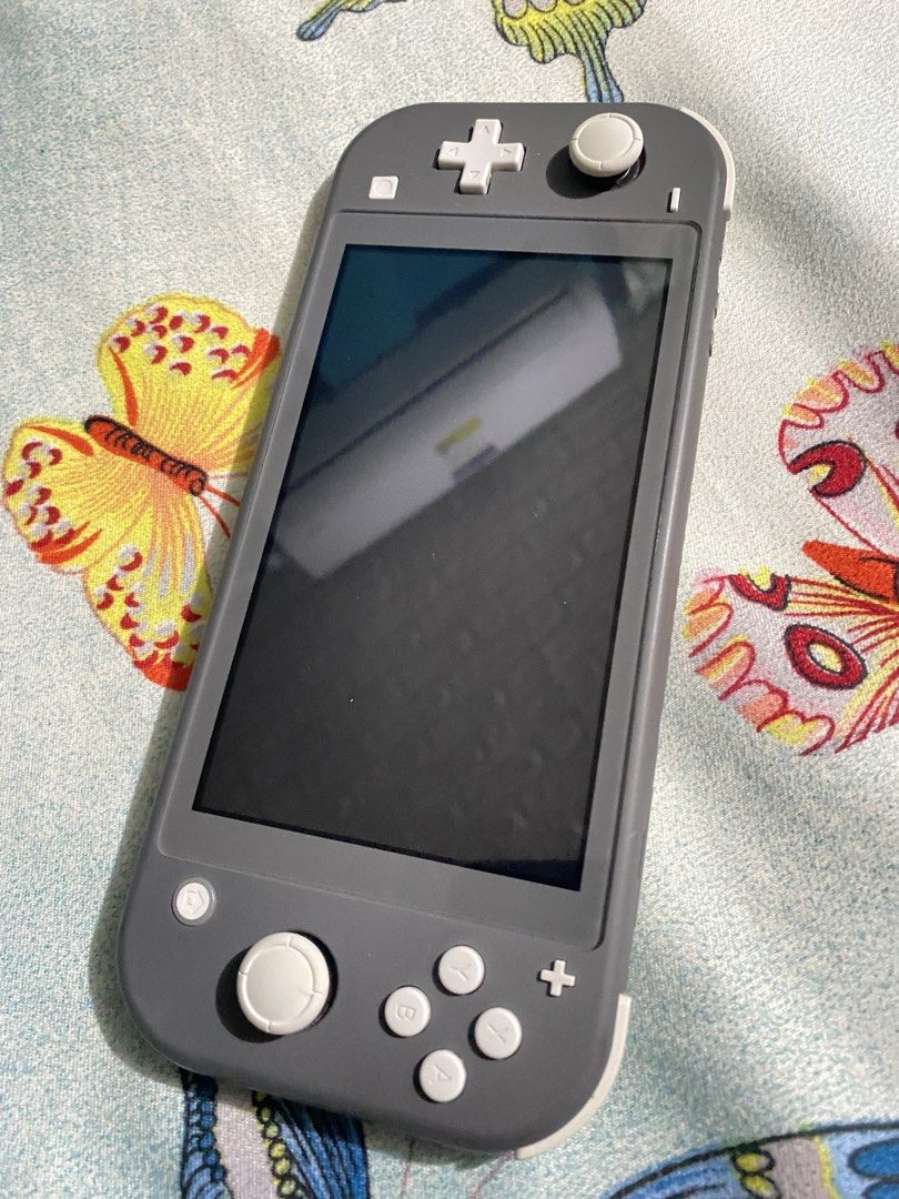 Nintendo Switch Lite Grey (Category: Nintendo) located in General Trias. Submitted by eddd14 (Listing ID 1470504417, Image 2). Description: For Sale Nintendo Switch Lite Gray No issue, No dents ✨ Nintendo Switch Lite Original Charger Pokemon Steelcase Tempered Glass 2 Physical Games Cartridge: - Assassins Creed Rebel Collection (2in1 Game) - Trials of Mana Price: ₱7,000 (fixed price) Location: General Trias, Cavite.